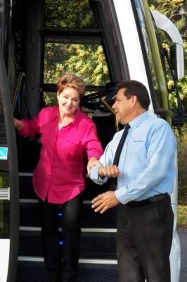 Driver helping a woman get off the bus